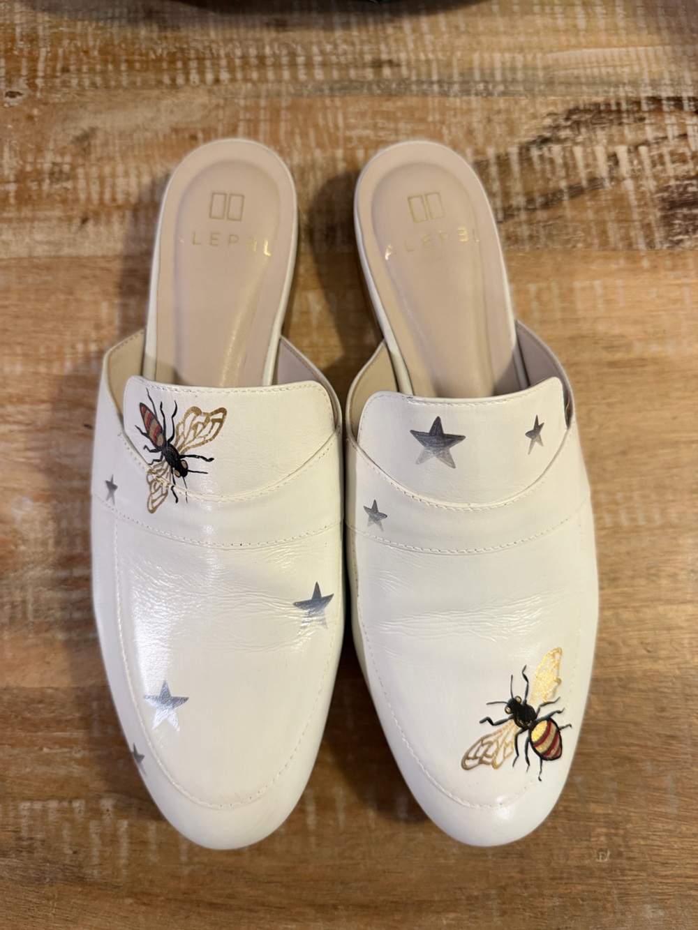 Hand painted. Women’s white Alepel "Bee and Star" mules size 9.